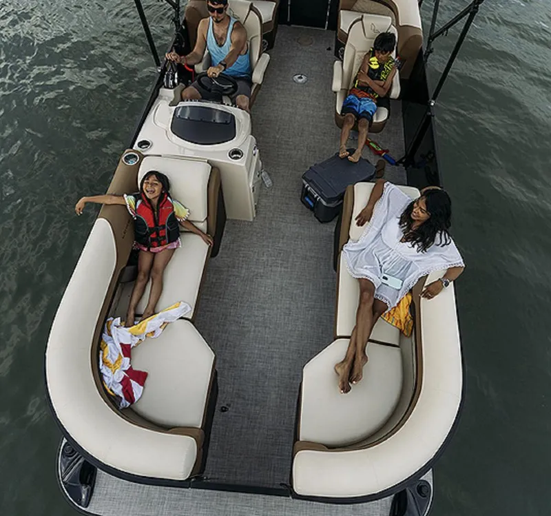 Slide: The Image of 2025 Lowe SS230WT pontoon boat with passengers enjoying a relaxing day on the water. - 13