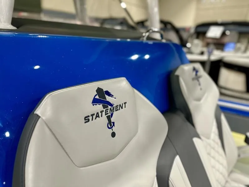 Slide: The Image of 2025 Statement 350 Open Center Console boat interior with branded seating. - 12
