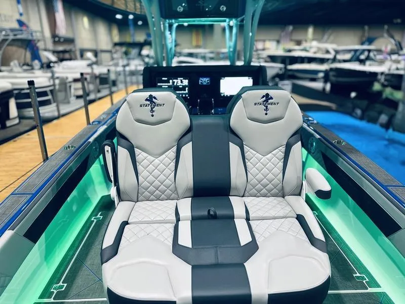 Slide: The Image of 2025 Statement 350 Open Center Console boat with luxurious seating and modern dashboard. - 14