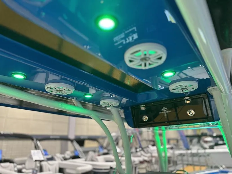 Slide: The Image of 2025 Statement 350 Open Center Console with green LED lights and speakers. - 15