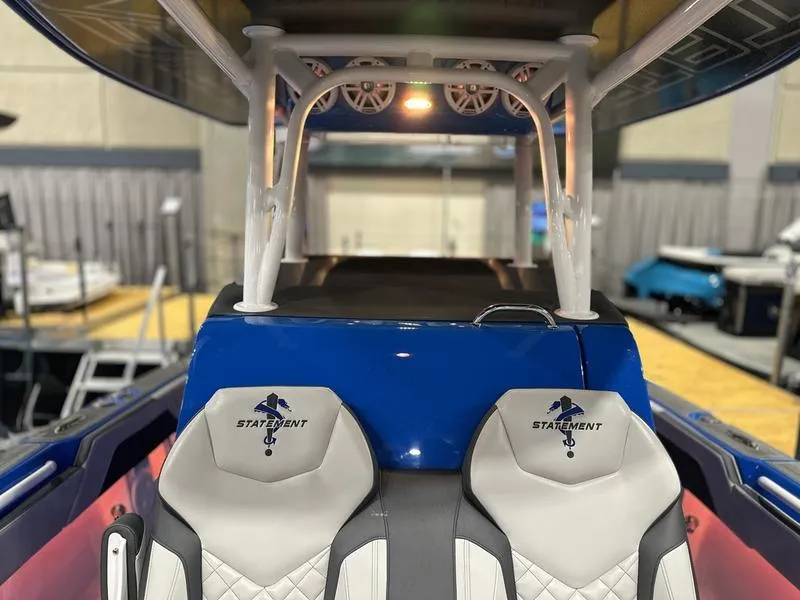 Slide: The Image of 2025 Statement 350 Open Center Console boat interior with branded seats and modern design. - 20