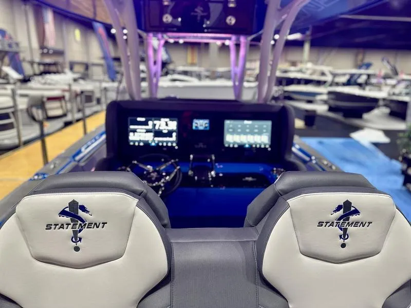 Slide: The Image of 2025 Statement 350 Open Center Console boat interior with advanced dashboard and seating. - 22