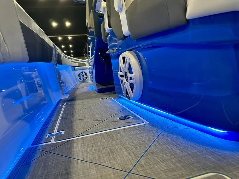 Slide: The Image of 2025 Statement 350 Open Center Console with blue LED lighting and modern interior design. - 4
