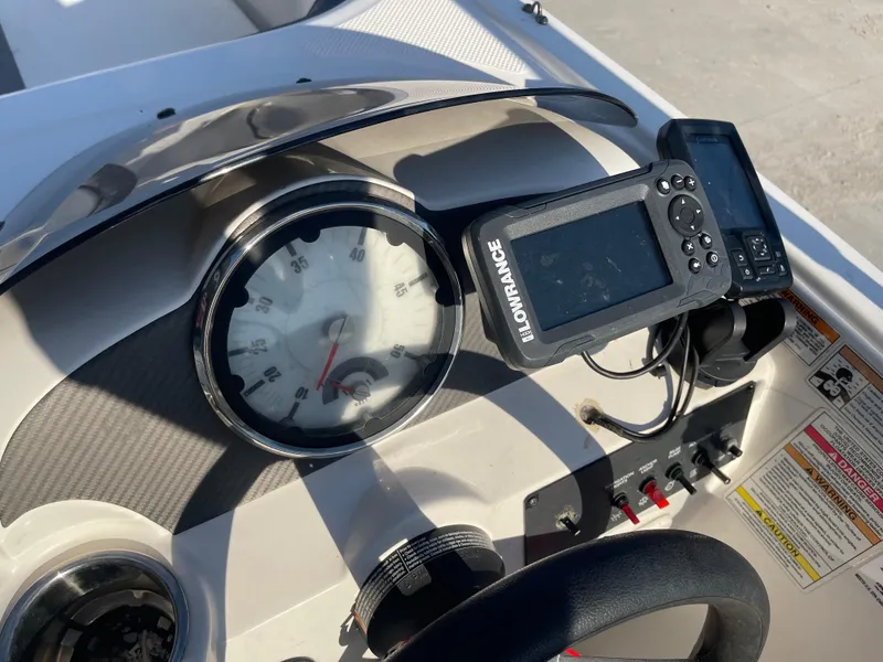Slide: The Image of Dashboard of 2017 Bayliner Element E16 with Lowrance GPS and speedometer. - 17