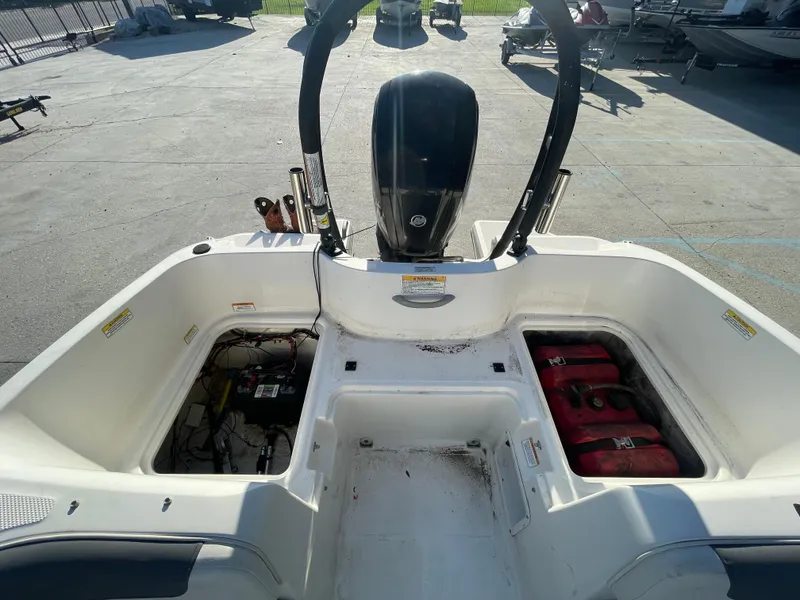 Slide: The Image of 2017 Bayliner Element E16 boat interior with engine and storage compartments. - 18