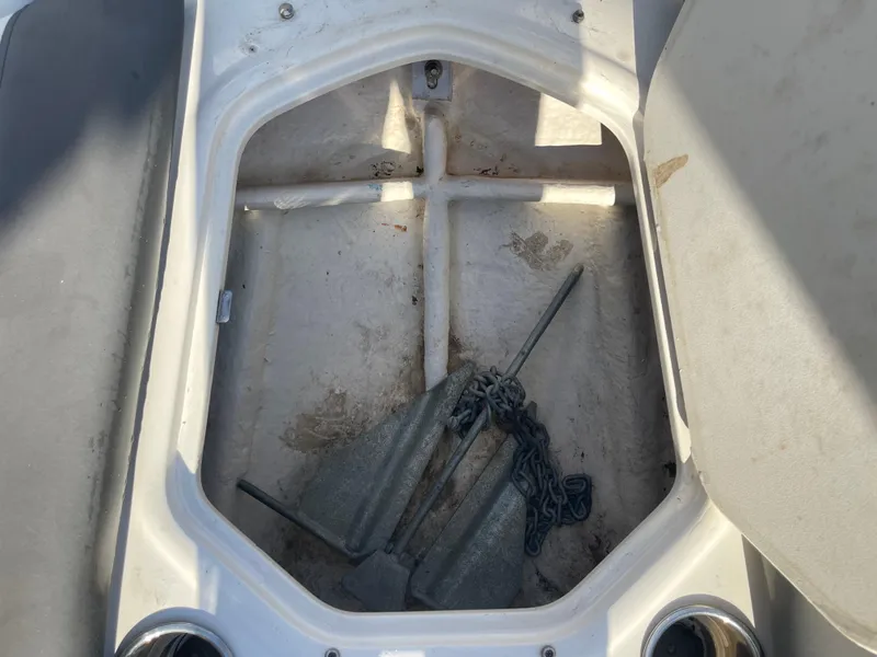 Slide: The Image of 2017 Bayliner Element E16 anchor storage compartment with anchor and chain. - 23