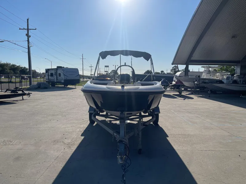 Slide: The Image of 2017 Bayliner Element E16 boat on trailer under bright sunlight. - 5