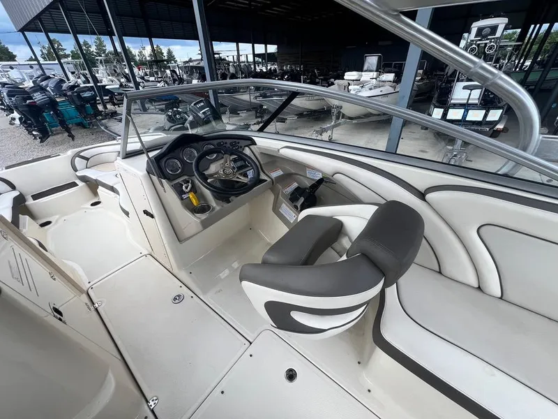 Slide: The Image of 2014 Yamaha Boats 242 Limited S interior with steering wheel and seating. - 14