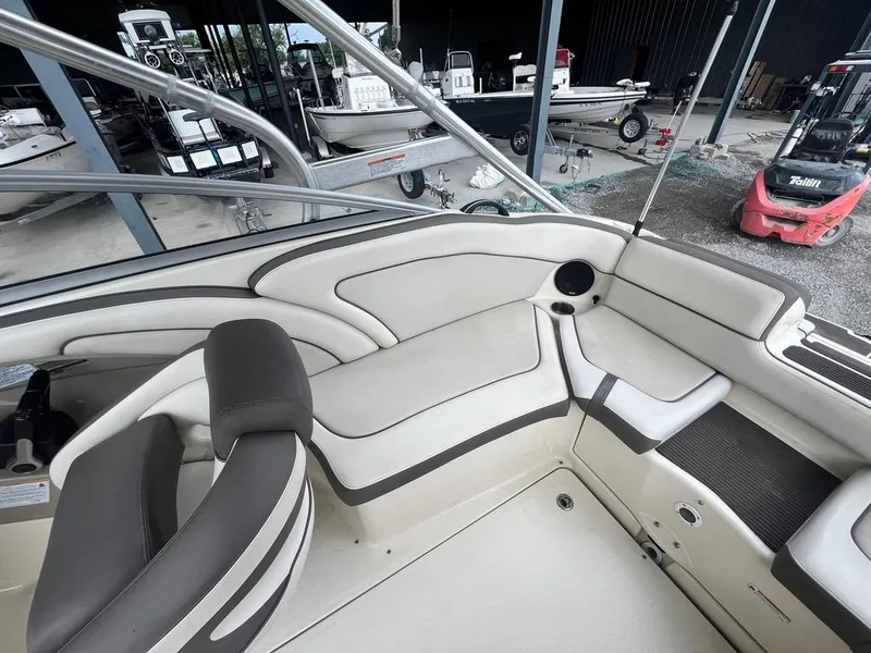 Slide: The Image of 2014 Yamaha Boats 242 Limited S interior with beige seating and modern design. - 15