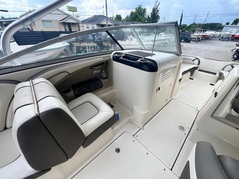 Slide: The Image of 2014 Yamaha Boats 242 Limited S interior with seating and dashboard view. - 18