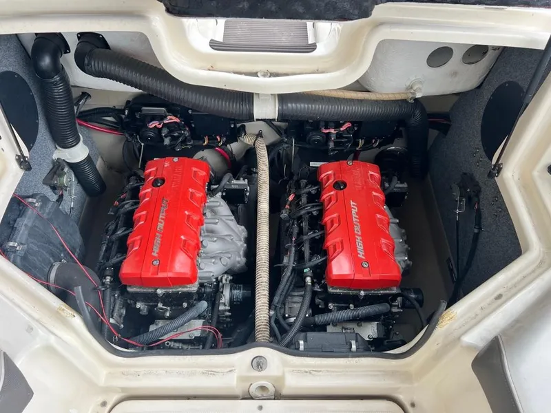 Slide: The Image of Twin engines of a 2014 Yamaha Boats 242 Limited S with red covers. - 20