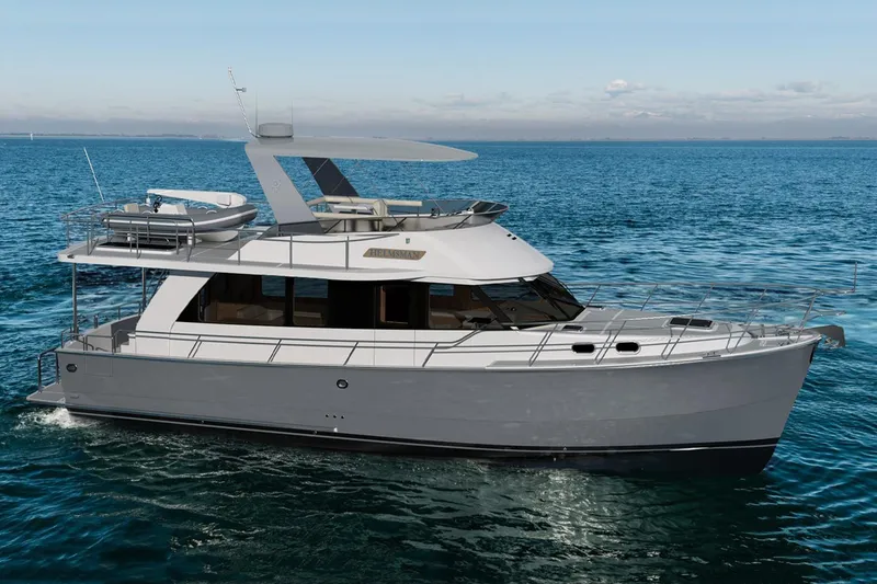 Slide: The Image of 2026 Helmsman Trawlers 43 Sedan yacht cruising on open water. - 3