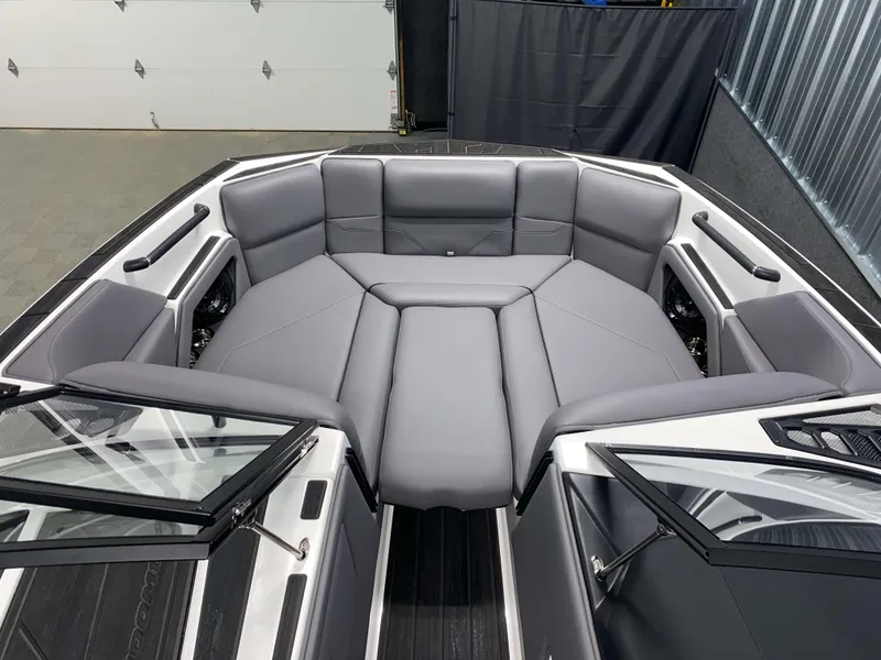 Slide: The Image of 2025 Moomba Max boat interior with gray seating and sleek design. - 15