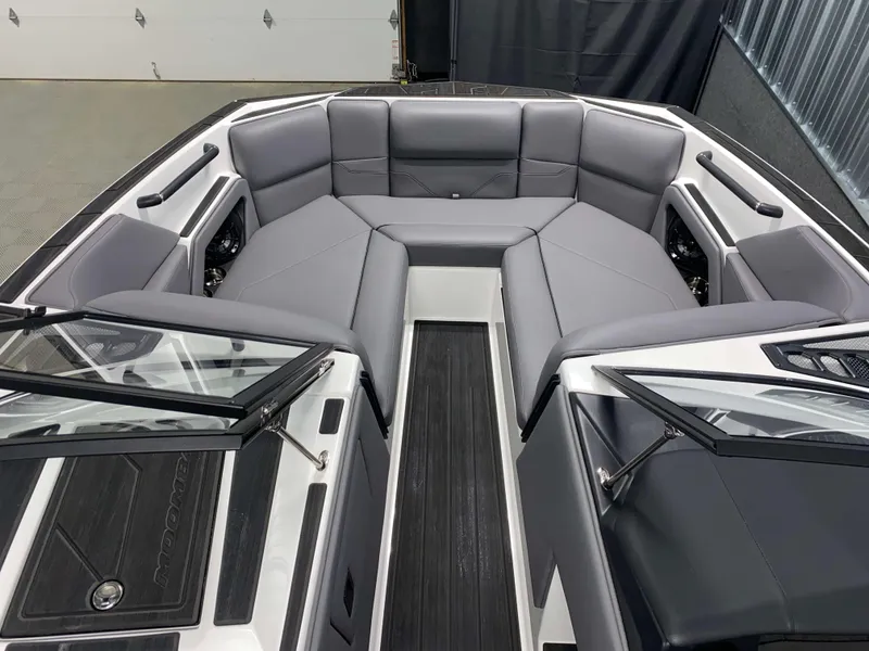 Slide: The Image of 2025 Moomba Max boat interior with sleek gray seating and modern design. - 16