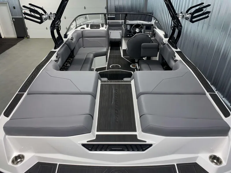 Slide: The Image of 2025 Moomba Max boat interior with gray seating and sleek design. - 3