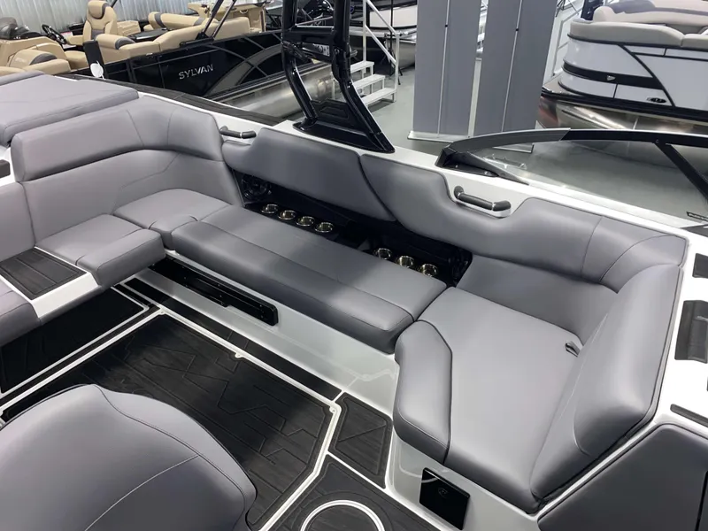 Slide: The Image of 2025 Moomba Max boat interior with sleek gray seating and modern design. - 8
