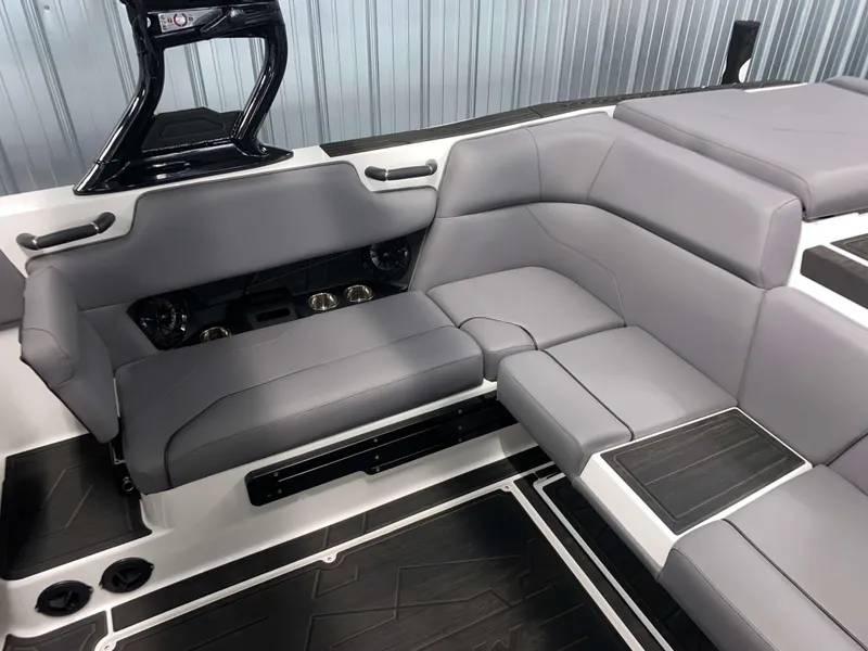 Slide: The Image of 2025 Moomba Max boat interior with sleek gray seating and modern design. - 9