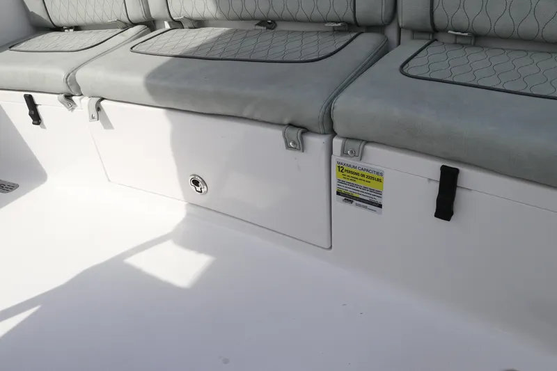 Slide: The Image of 2019 Sportsman Heritage 231 Center Console seating area with storage compartment. - 10