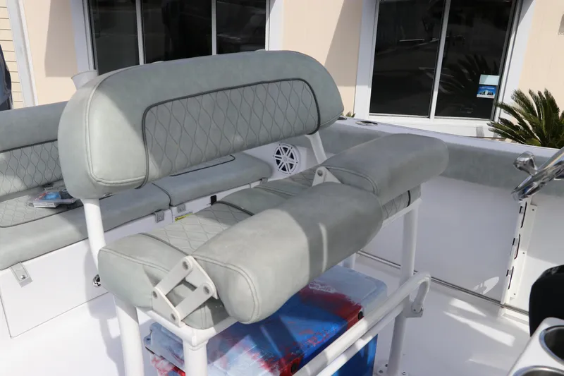 Slide: The Image of 2019 Sportsman Heritage 231 Center Console boat interior with cushioned seating. - 17
