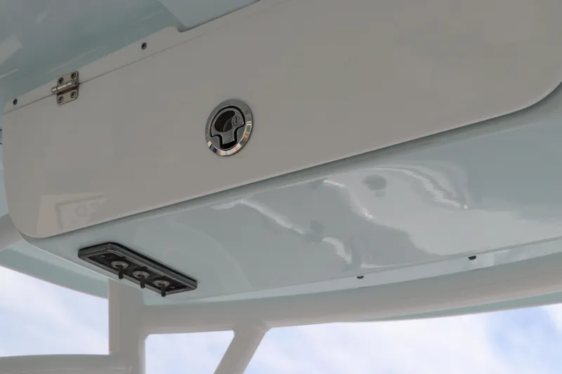 Slide: The Image of 2019 Sportsman Heritage 231 Center Console storage compartment detail. - 19