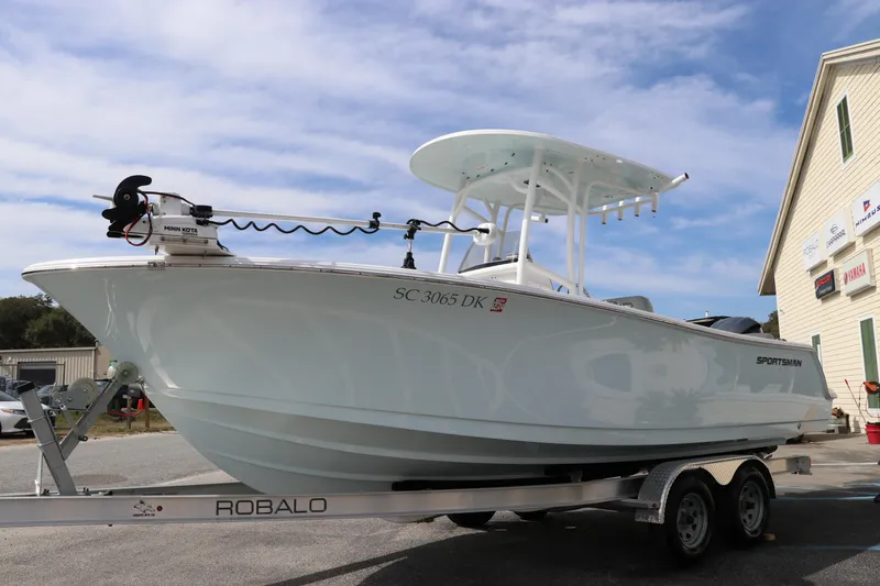 Slide: The Image of 2019 Sportsman Heritage 231 Center Console boat on a Robalo trailer. - 2