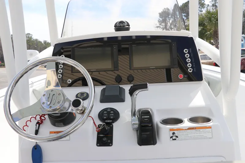 Slide: The Image of 2019 Sportsman Heritage 231 Center Console dashboard with steering wheel and controls. - 20