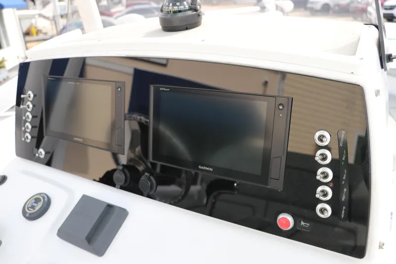 Slide: The Image of 2019 Sportsman Heritage 231 Center Console dashboard with dual Garmin displays. - 21