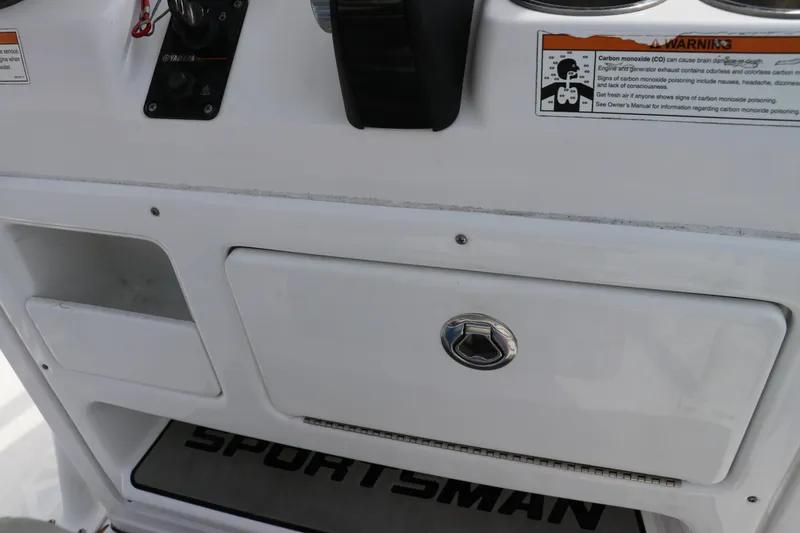 Slide: The Image of 2019 Sportsman Heritage 231 Center Console dashboard with storage compartment. - 23