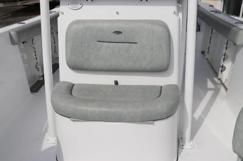 Slide: The Image of 2019 Sportsman Heritage 231 Center Console boat seating area with cushioned backrest. - 27