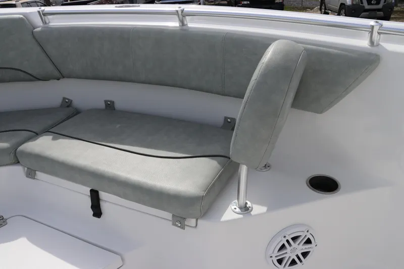 Slide: The Image of 2019 Sportsman Heritage 231 Center Console boat seating area with cushioned seats. - 30