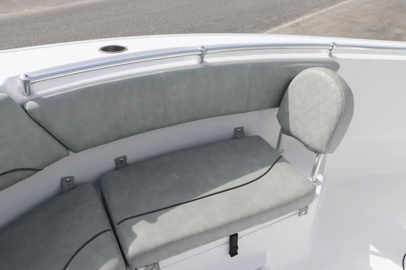 Slide: The Image of 2019 Sportsman Heritage 231 Center Console boat seating area with cushioned seats and backrest. - 31