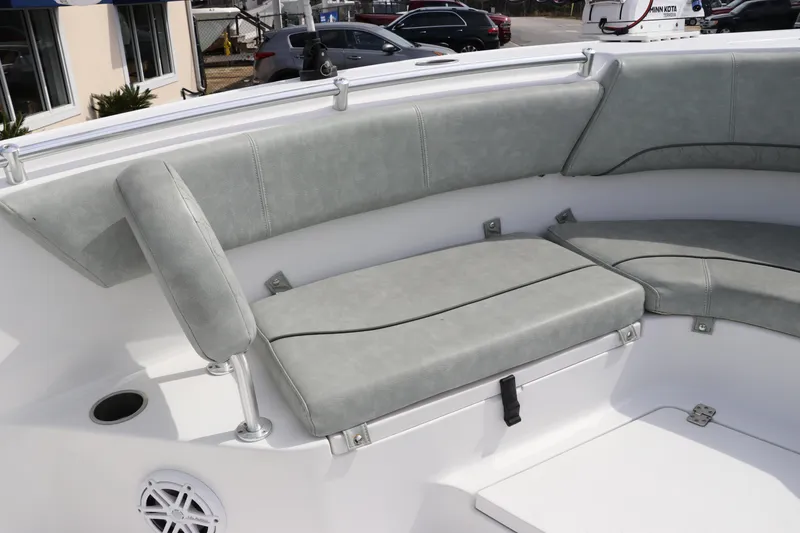 Slide: The Image of 2019 Sportsman Heritage 231 Center Console boat with cushioned seating area. - 32