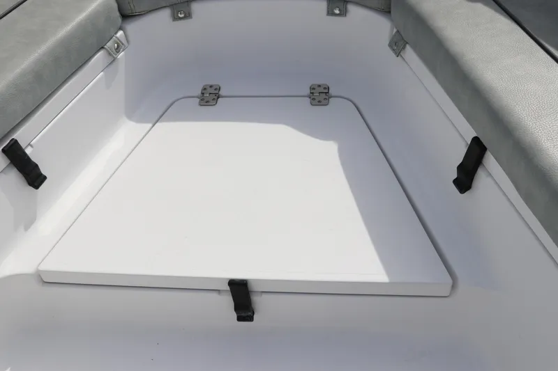 Slide: The Image of 2019 Sportsman Heritage 231 Center Console boat interior storage compartment. - 34