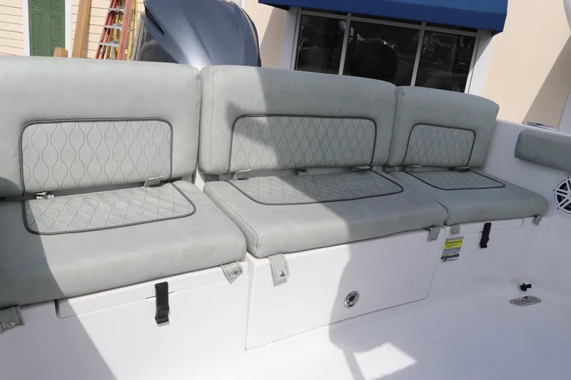 Slide: The Image of 2019 Sportsman Heritage 231 Center Console boat seating with cushioned backrests. - 7