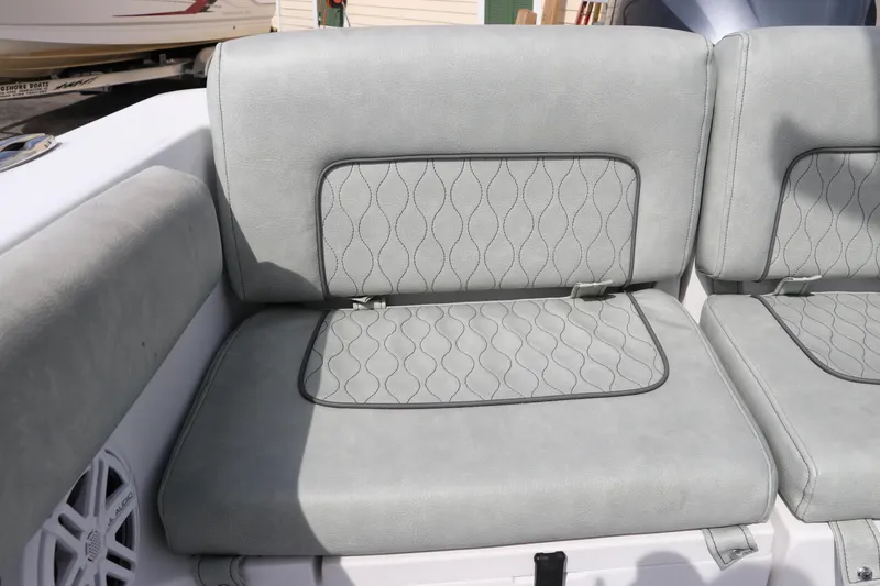 Slide: The Image of 2019 Sportsman Heritage 231 Center Console boat seat with quilted gray upholstery. - 8