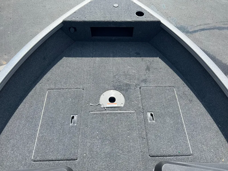 Slide: The Image of 2024 Crestliner 1650 Hawk WT boat deck with storage compartments. - 11