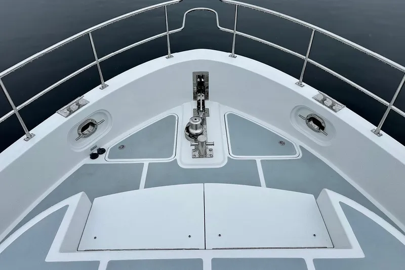 Slide: The Image of Helmsman Trawlers 46 Pilothouse 2026 bow deck with railing and anchor system. - 11