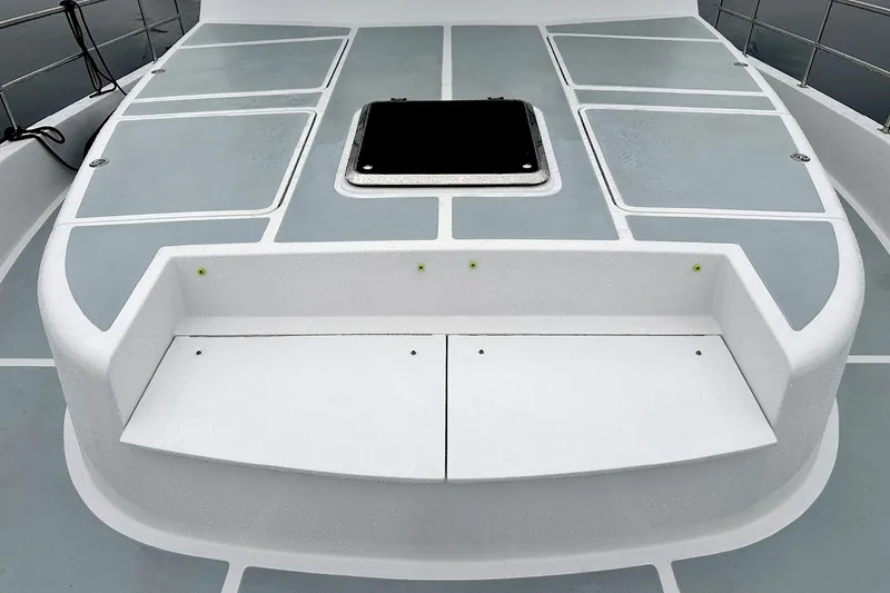 Slide: The Image of 2026 Helmsman Trawlers 46 Pilothouse deck with storage compartments and hatch. - 12