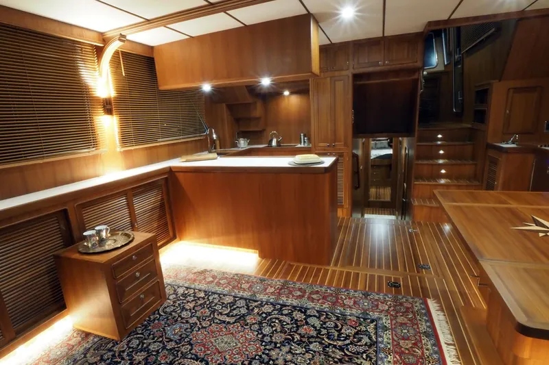 Slide: The Image of Luxurious interior of 2026 Helmsman Trawlers 46 Pilothouse with elegant wood finishes. - 24