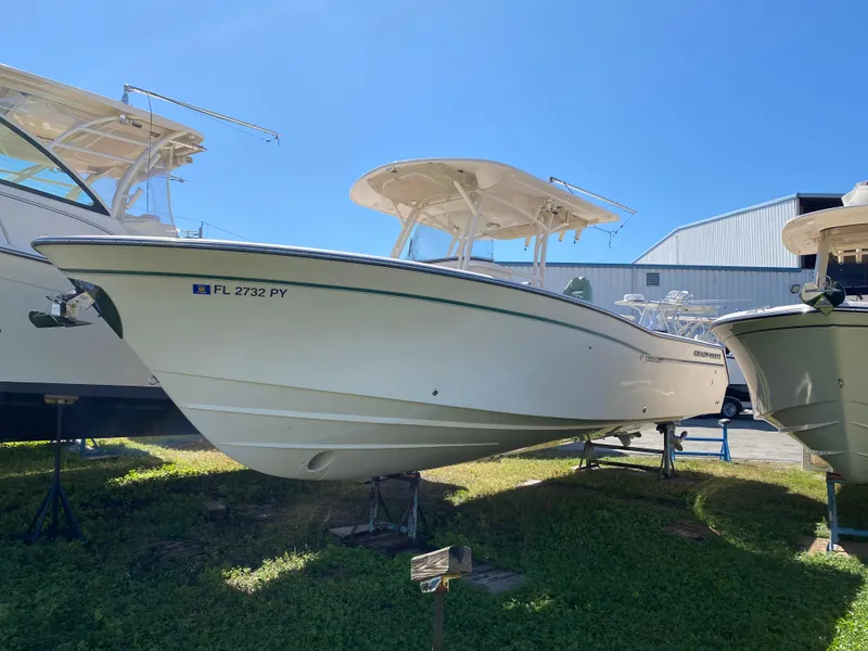 Slide: The Image of 2015 Grady-White Canyon 306 boat on display outdoors. - 1