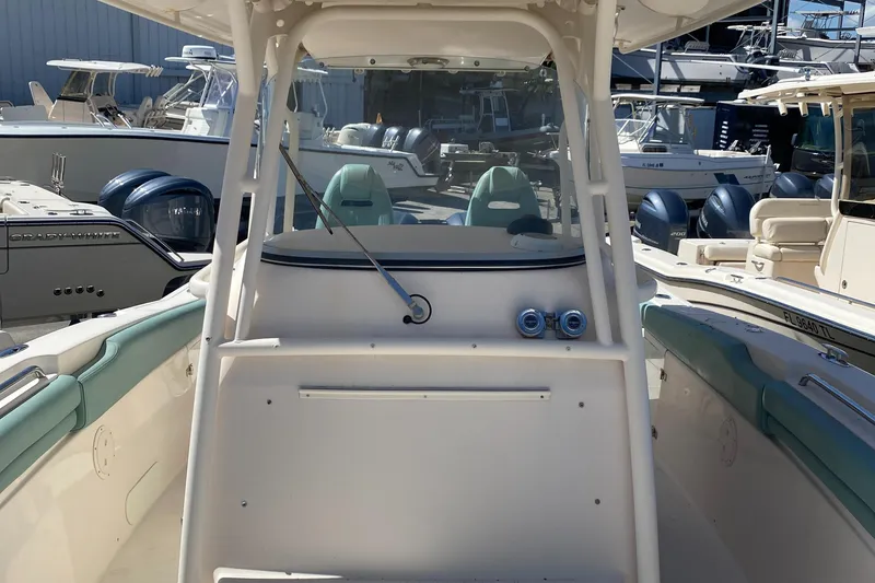 Slide: The Image of 2015 Grady-White Canyon 306 boat interior with dual seats and console. - 4
