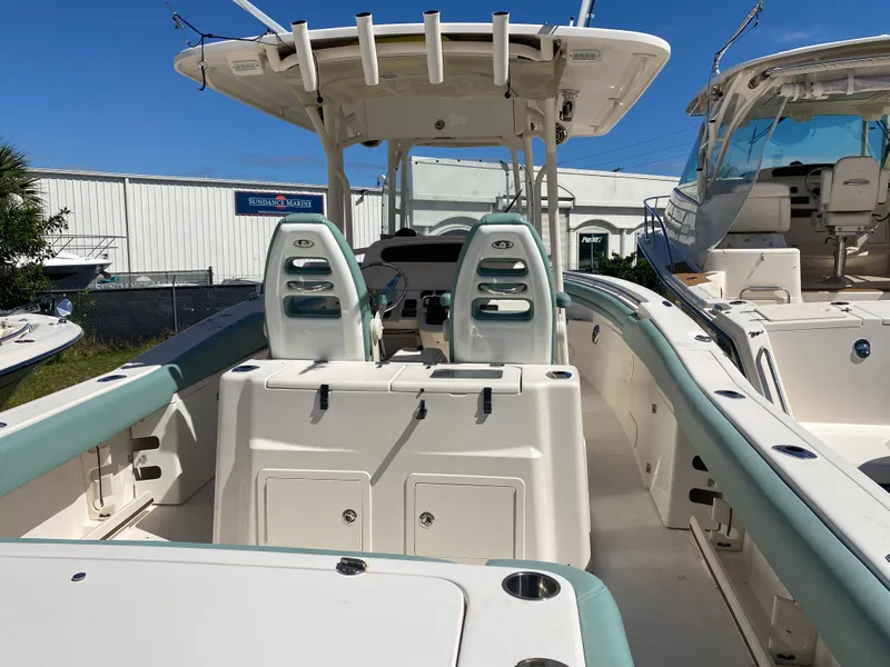 Slide: The Image of 2015 Grady-White Canyon 306 boat interior with dual seats and helm station. - 8