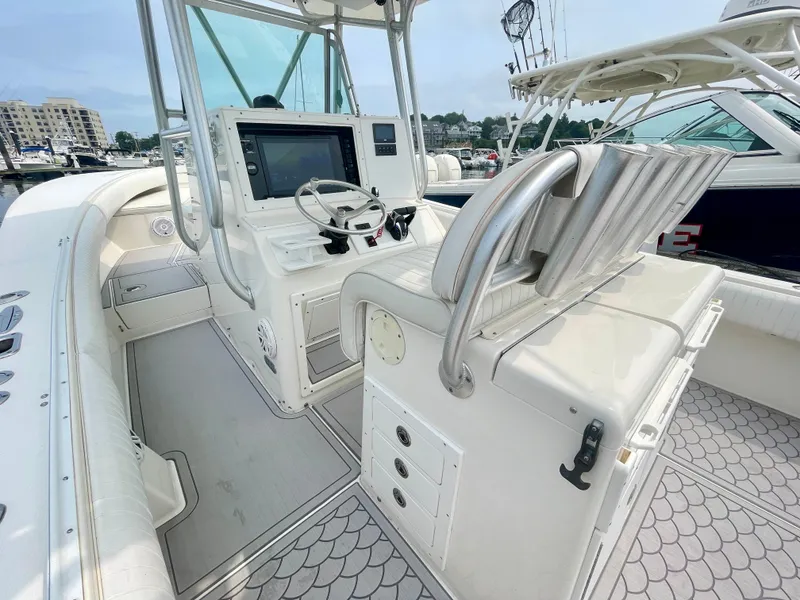 Slide: The Image of 2006 Regulator 32FS helm with joystick, featuring modern controls and spacious layout. - 12