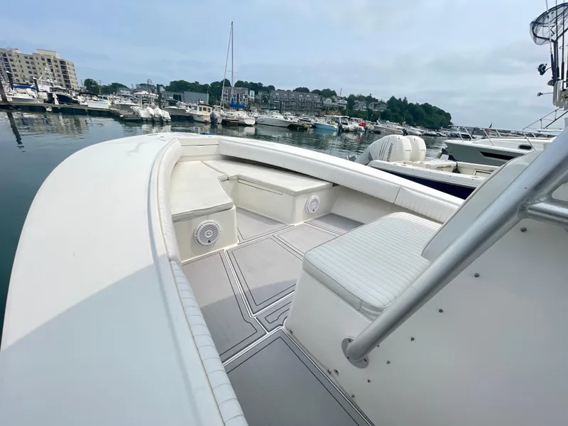Slide: The Image of 2006 Regulator 32FS boat with Helm Master Joystick, docked in a marina. - 13
