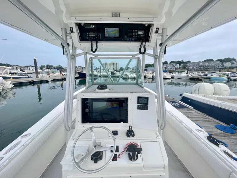 Slide: The Image of Helm of 2006 Regulator 32FS with joystick, docked at marina. - 4