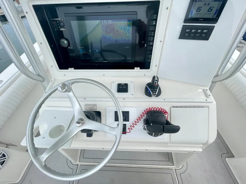 Slide: The Image of Helm of 2006 Regulator 32FS with joystick, steering wheel, and navigation display. - 5