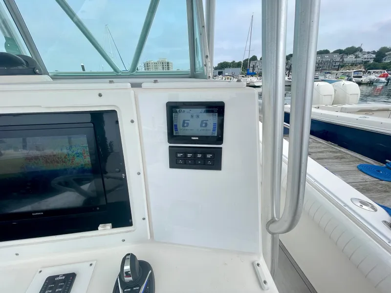 Slide: The Image of Helm of 2006 Regulator 32FS with joystick and display, docked in marina. - 6