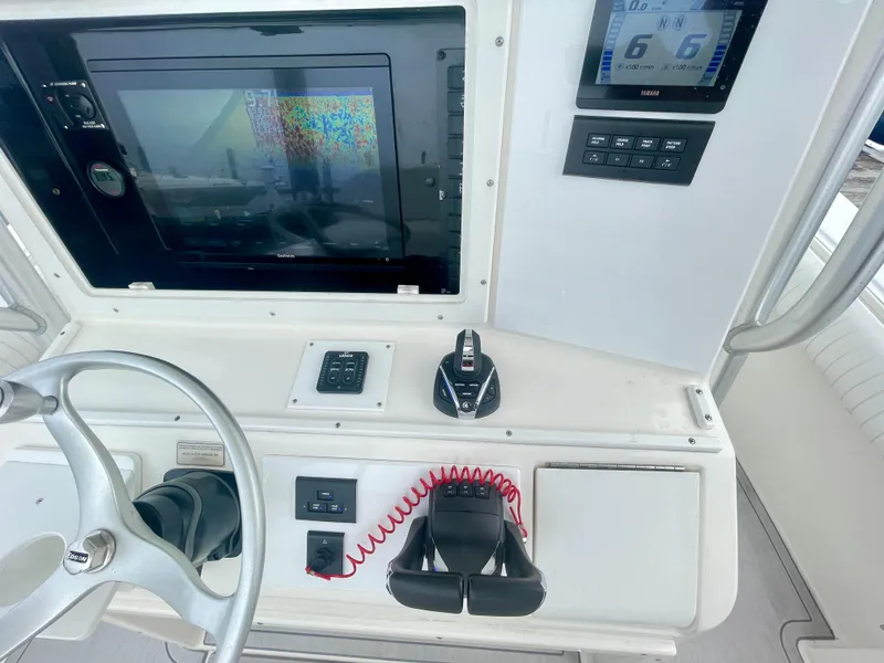 Slide: The Image of Helm of 2006 Regulator 32FS with joystick, steering wheel, and electronic displays. - 7