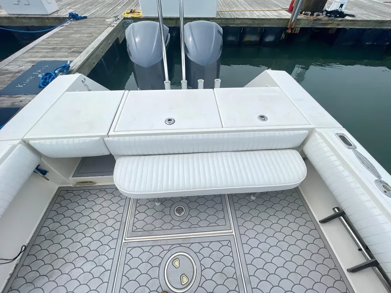 Slide: The Image of 2006 Regulator 32FS boat deck with helm master joystick, docked at marina. - 9