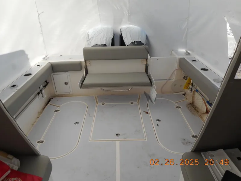 Slide: The Image of 2024 NorthCoast 255HT boat interior with seating and storage compartments. - 32